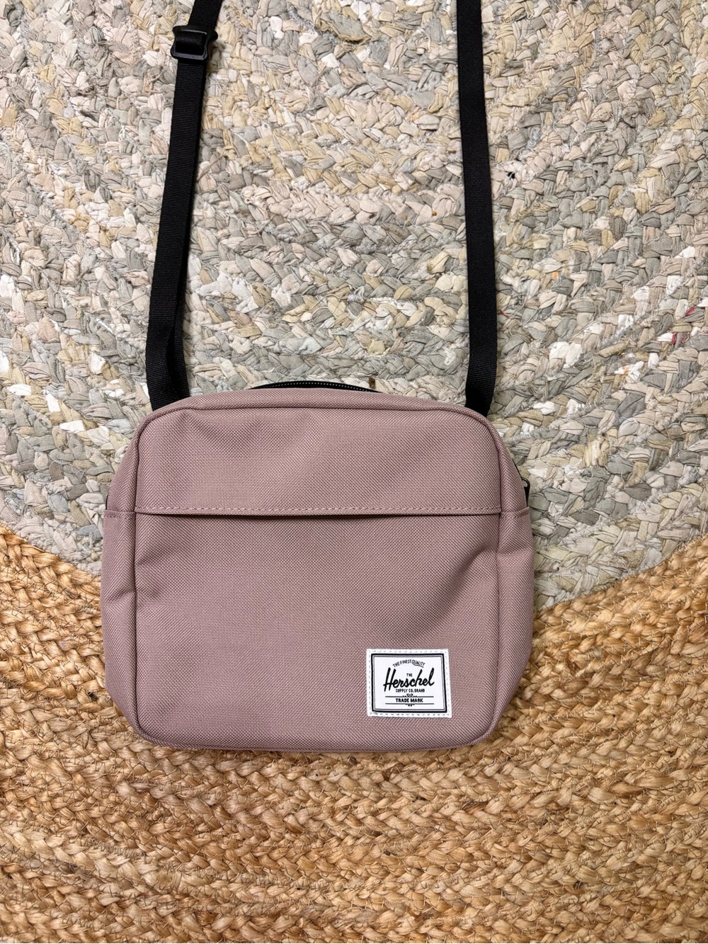Herschel Supply Company small crossbody in dusty rose with black strap